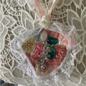 Handmade neckpiece made with vintage materials. Button closure on neck lace